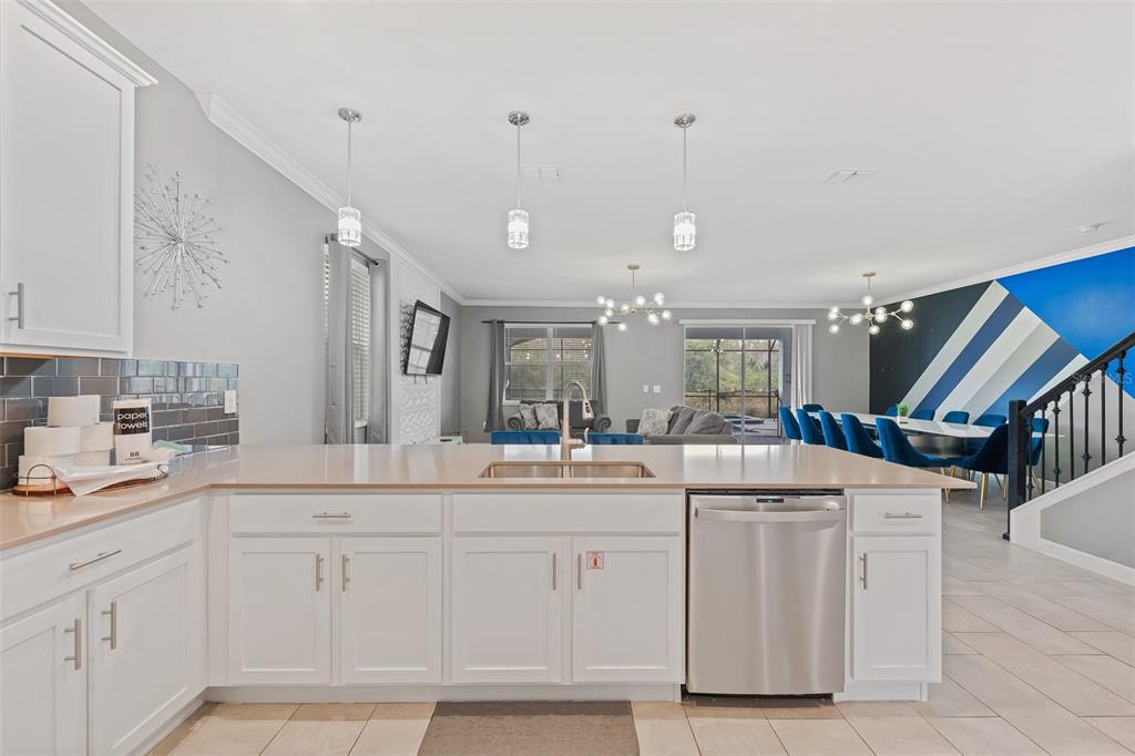 3000 Penelope Loop Kissimmee, FL 34746 - Photo 20 of 53 a kitchen with white cabinets and sink
