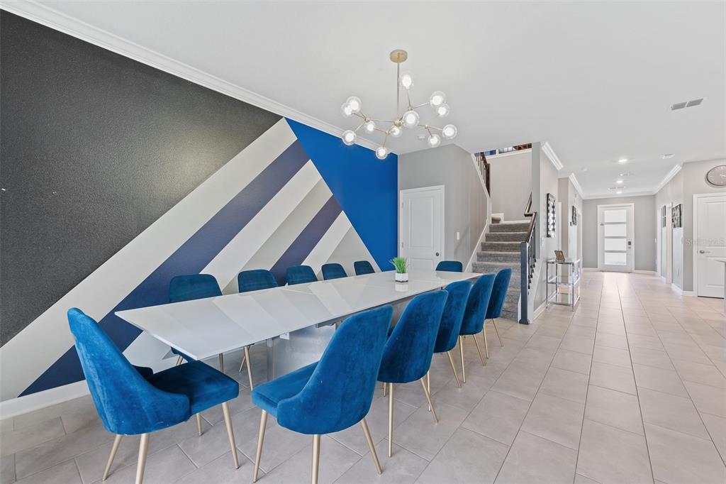 3000 Penelope Loop Kissimmee, FL 34746 - Photo 23 of 53 a dining room with furniture and chandelier