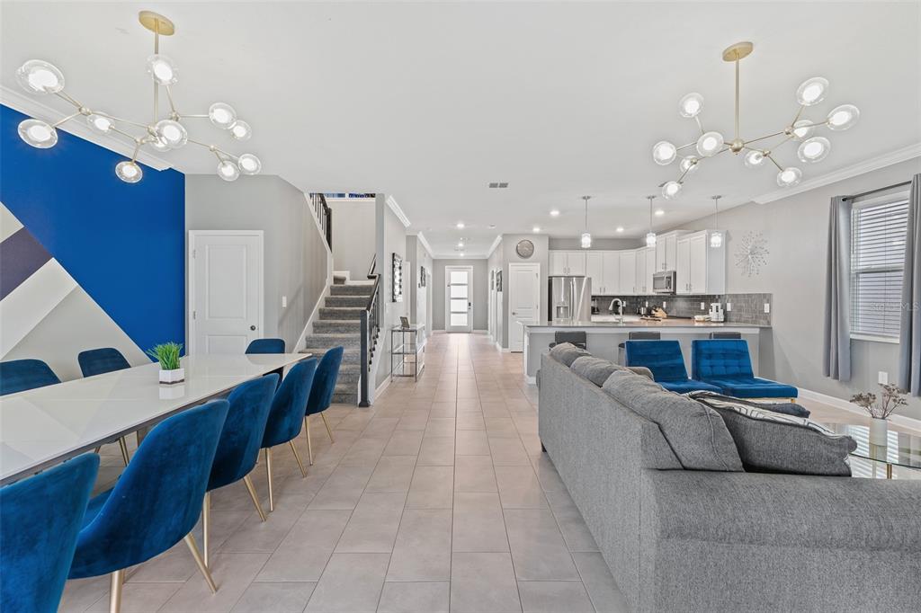 3000 Penelope Loop Kissimmee, FL 34746 - Photo 24 of 53 a living room with furniture kitchen and a chandelier