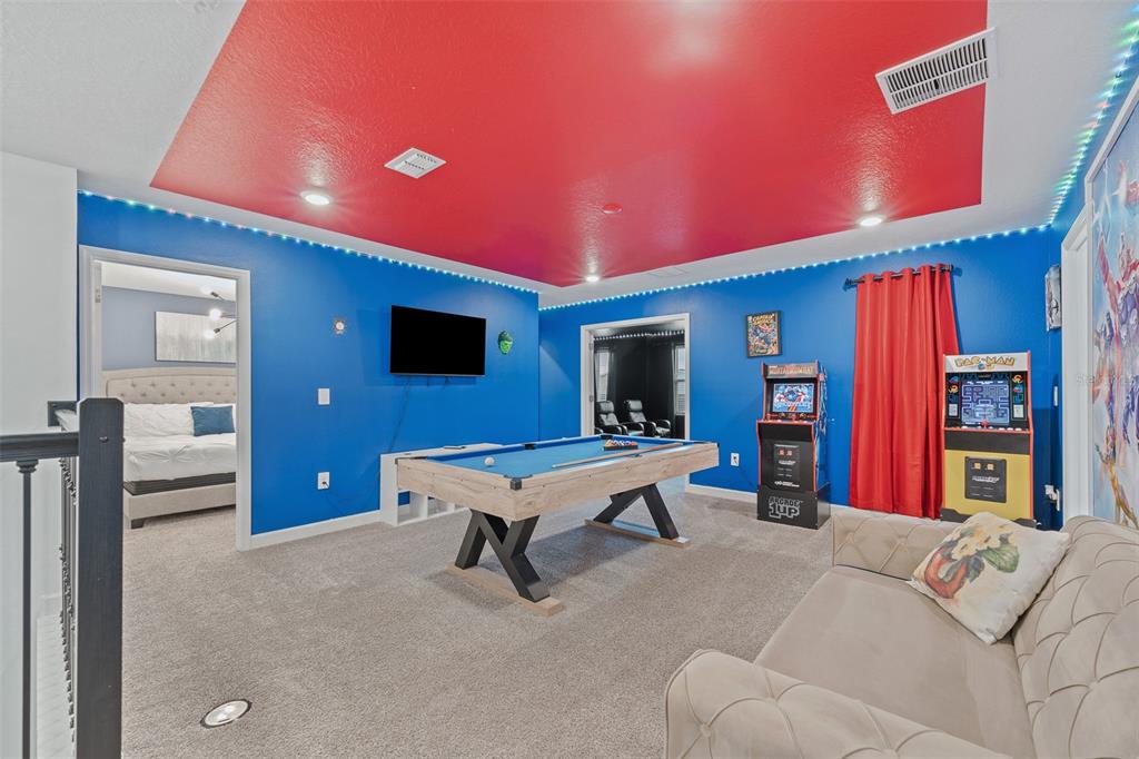 3000 Penelope Loop Kissimmee, FL 34746 - Photo 35 of 53 a living room with furniture and a flat screen tv