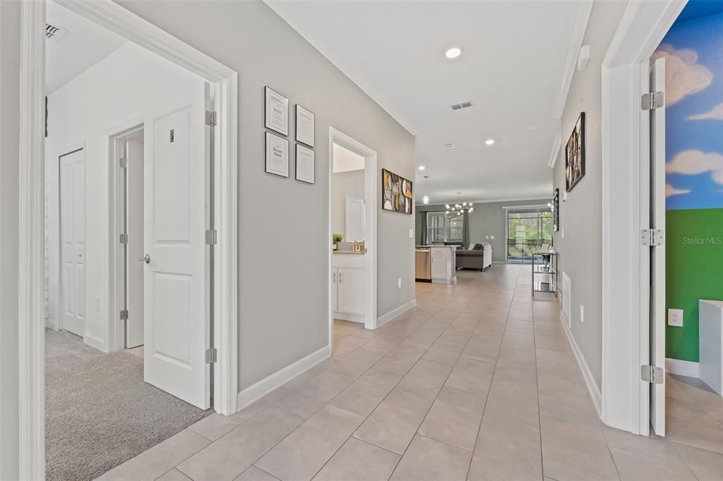 3000 Penelope Loop Kissimmee, FL 34746 - Photo 5 of 53 a view of a hallway with wooden shelves