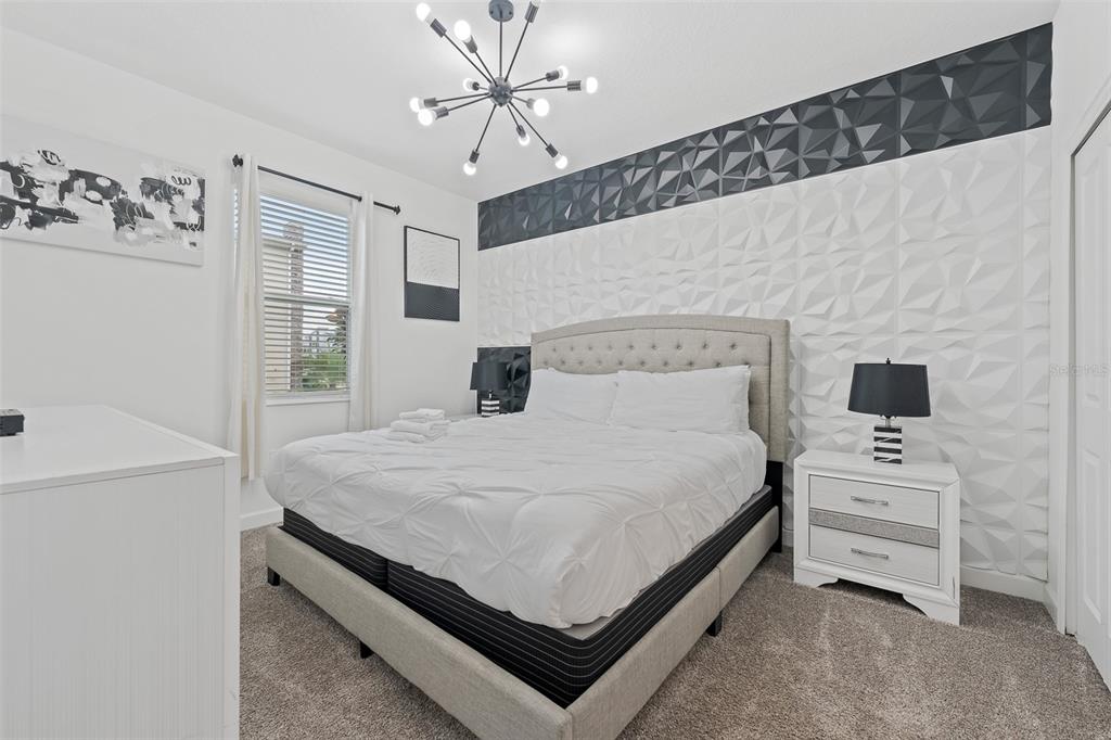 3000 Penelope Loop Kissimmee, FL 34746 - Photo 6 of 53 a bed room with a bed and a night stand