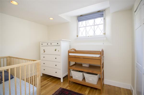116 Charles Street, Unit 1 Boston, MA 02114 - Photo 6 of 8 a view of bedroom with furniture and a window
