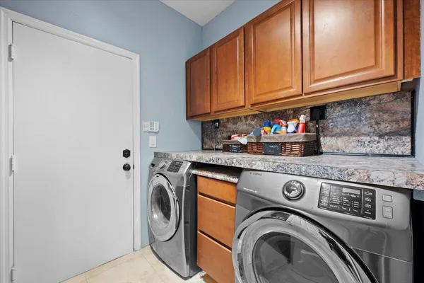 a utility room with dryer and washer