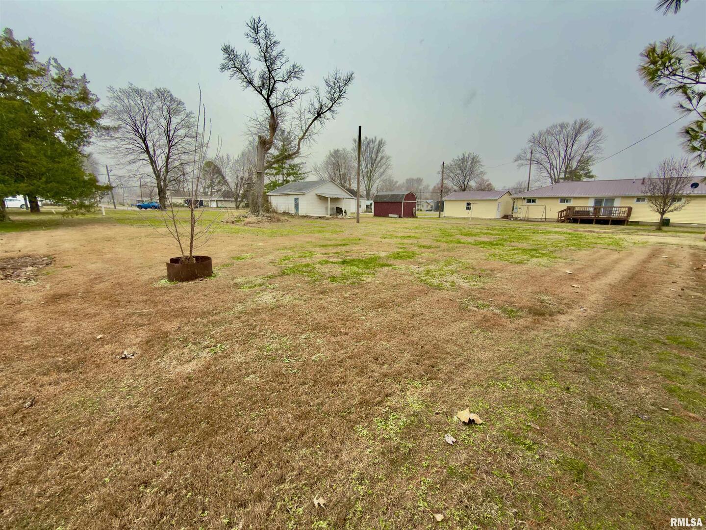 901 East 3rd Street Flora, IL 62839 - Photo 7 of 8 a swimming pool with an outdoor space and seating area