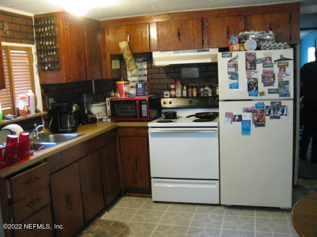 672 Georgetown Denver Road Crescent City, FL 32112 - Photo 16 of 23 KITCHEN VIEW #2 IMG_0197