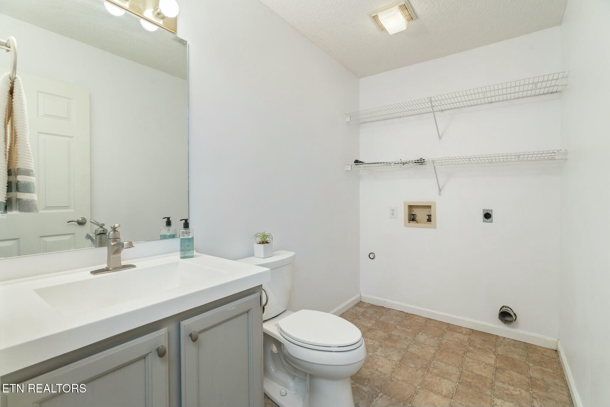 7809 Signal Station Road Knoxville, TN 37920 - Photo 33 of 39 Half bath/Laundry lower level