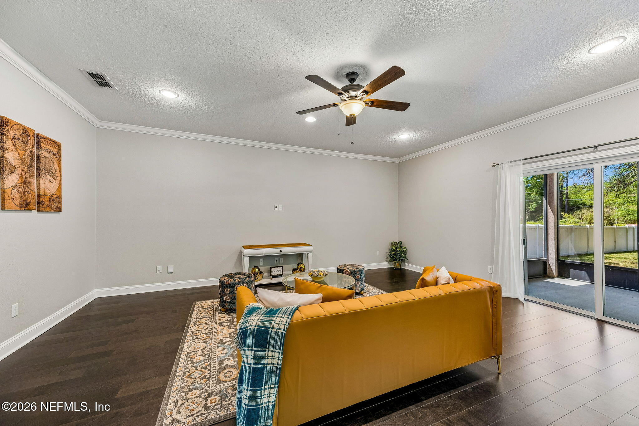 12198 Ridge Crossing Way Jacksonville, FL 32226 - Photo 11 of 67 a living room with a couch and a window