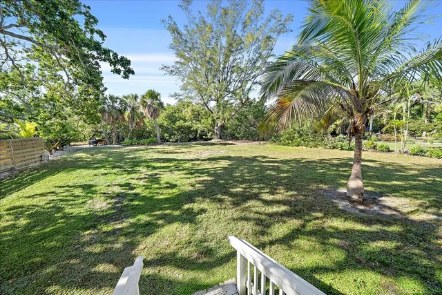 a view of a house with a small yard