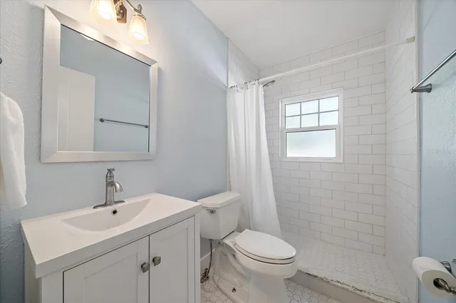 a bedroom with a bed and a table