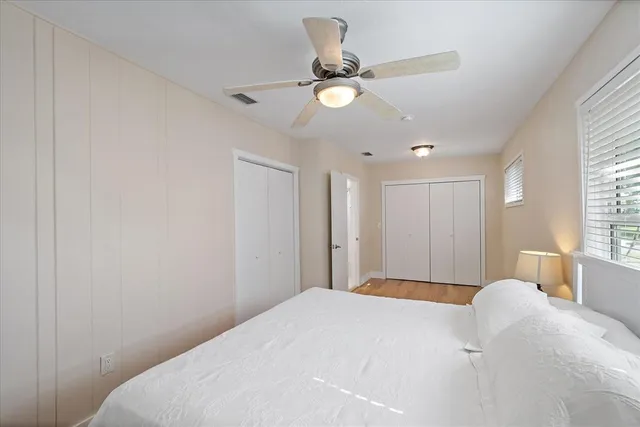 a bedroom with a bed and a table