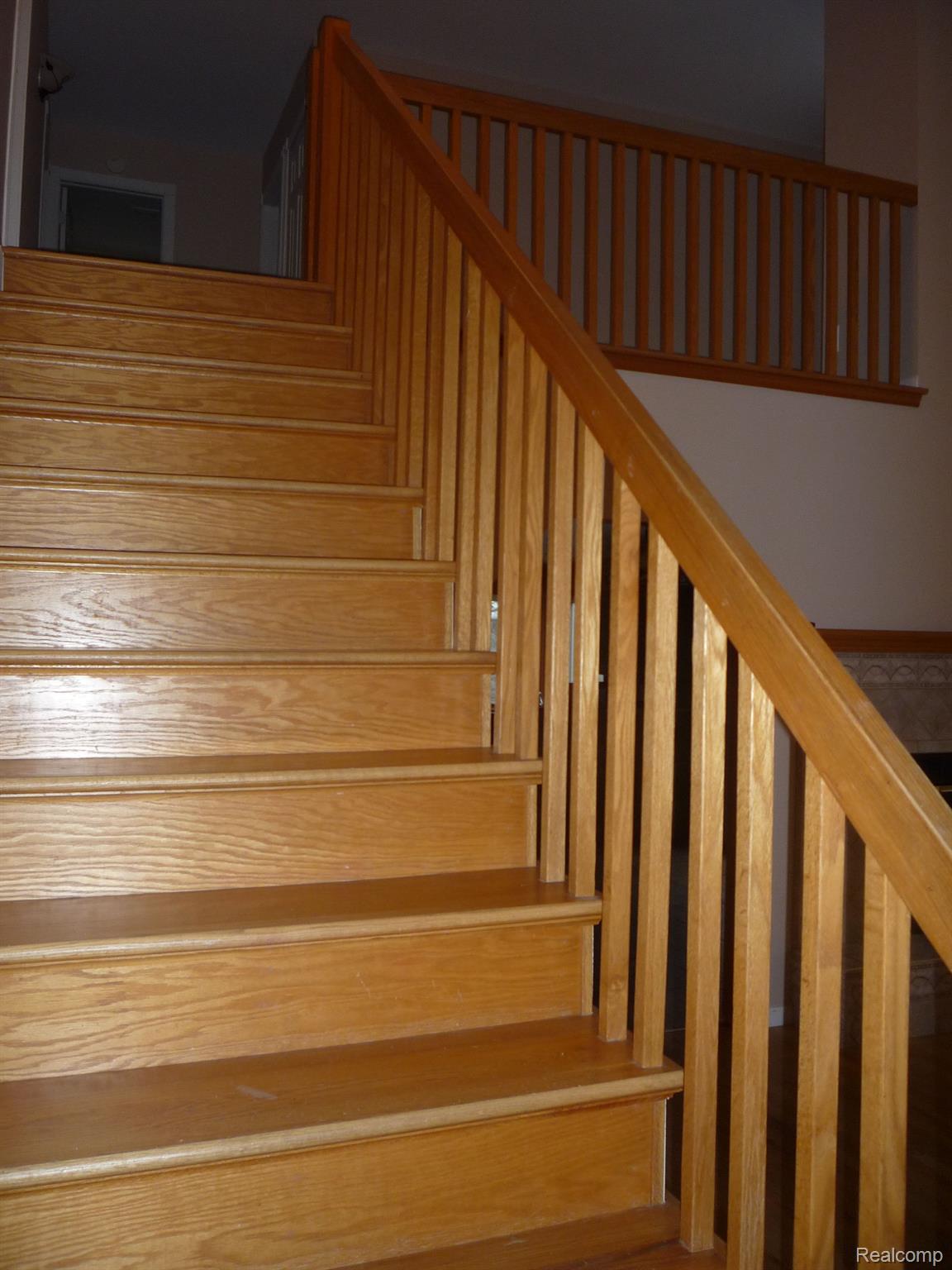 1423 Rillview Court Metamora, MI 48455 - Photo 41 of 62 stairway leading to second level and loft