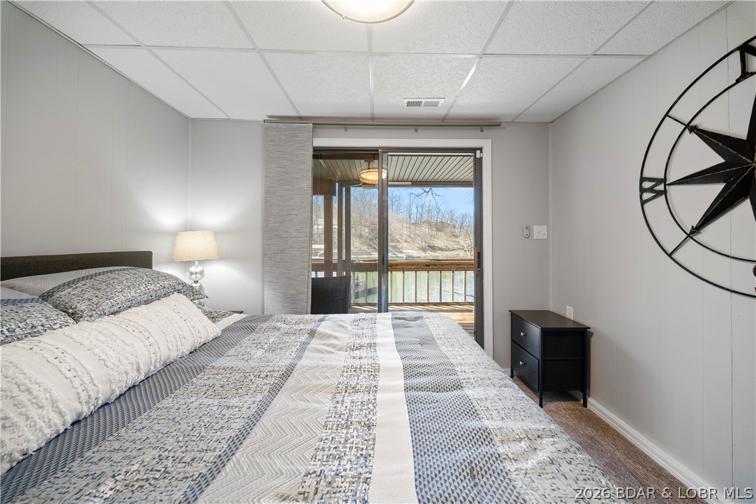 498 Wilmore Road Lake Ozark, MO 65049 - Photo 14 of 57 Guest bedroom on lower level has lake view & acces