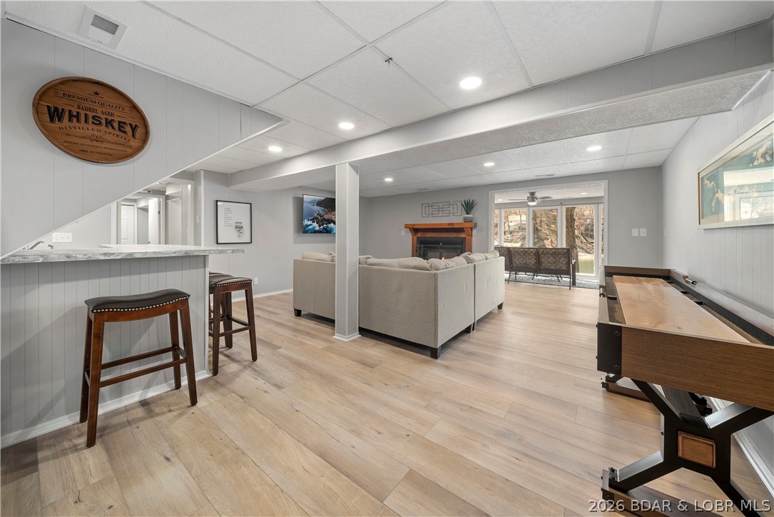 498 Wilmore Road Lake Ozark, MO 65049 - Photo 16 of 57 Lower level living room is ready for fun! Shuffleb