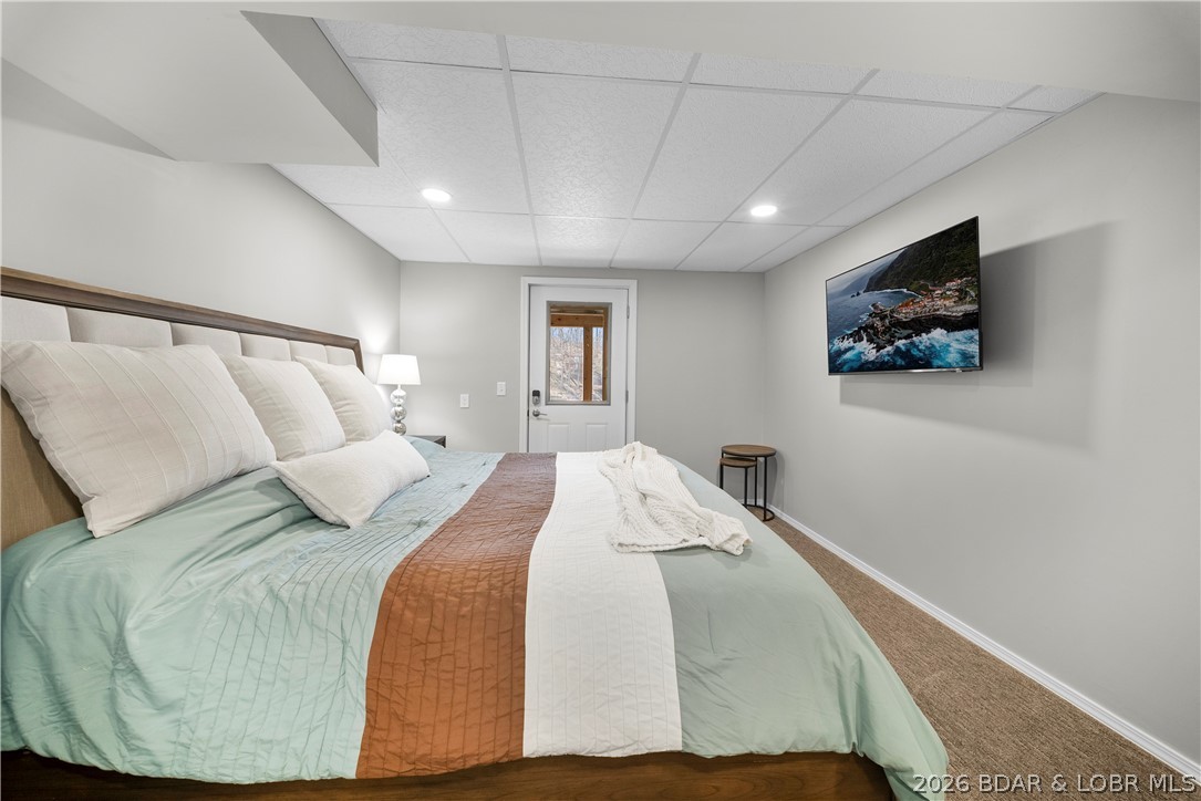 498 Wilmore Road Lake Ozark, MO 65049 - Photo 21 of 57 Guest bedroom of lower level with deck/lake access
