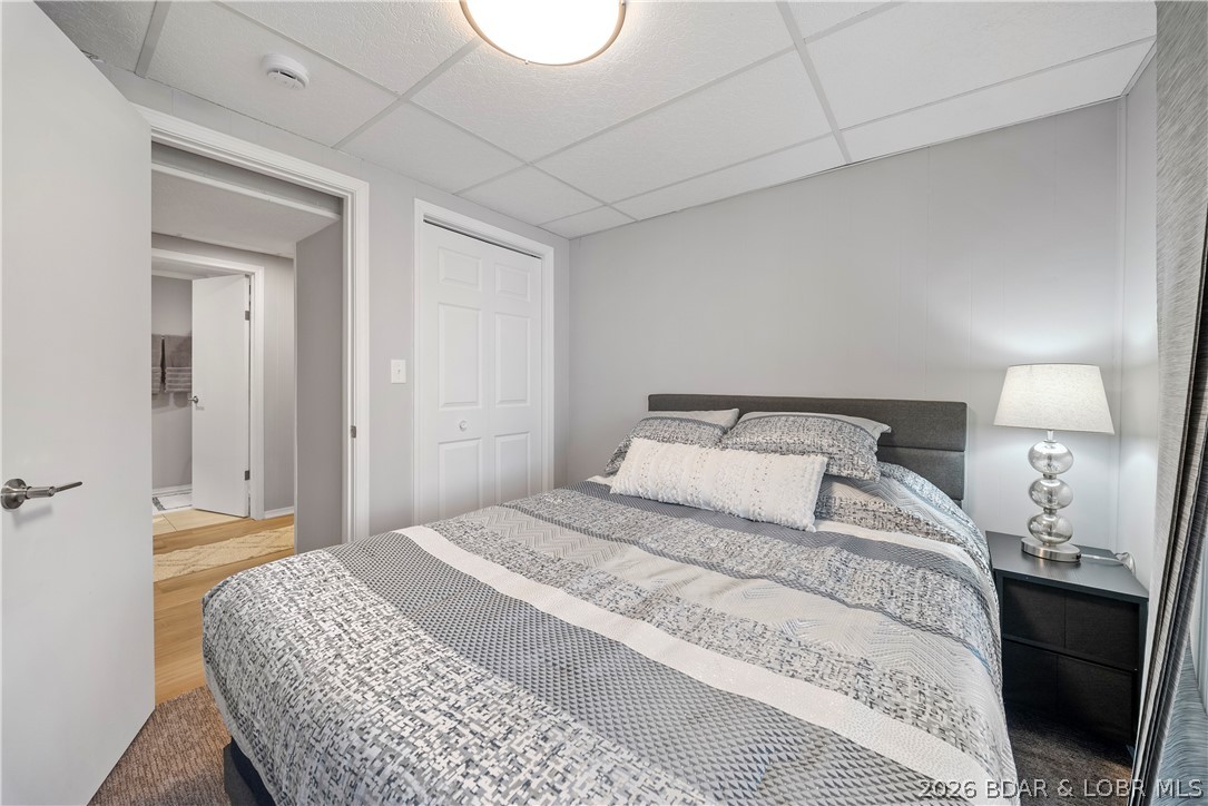 498 Wilmore Road Lake Ozark, MO 65049 - Photo 22 of 57 Add'l guest bedroom lower level with deck lake acc