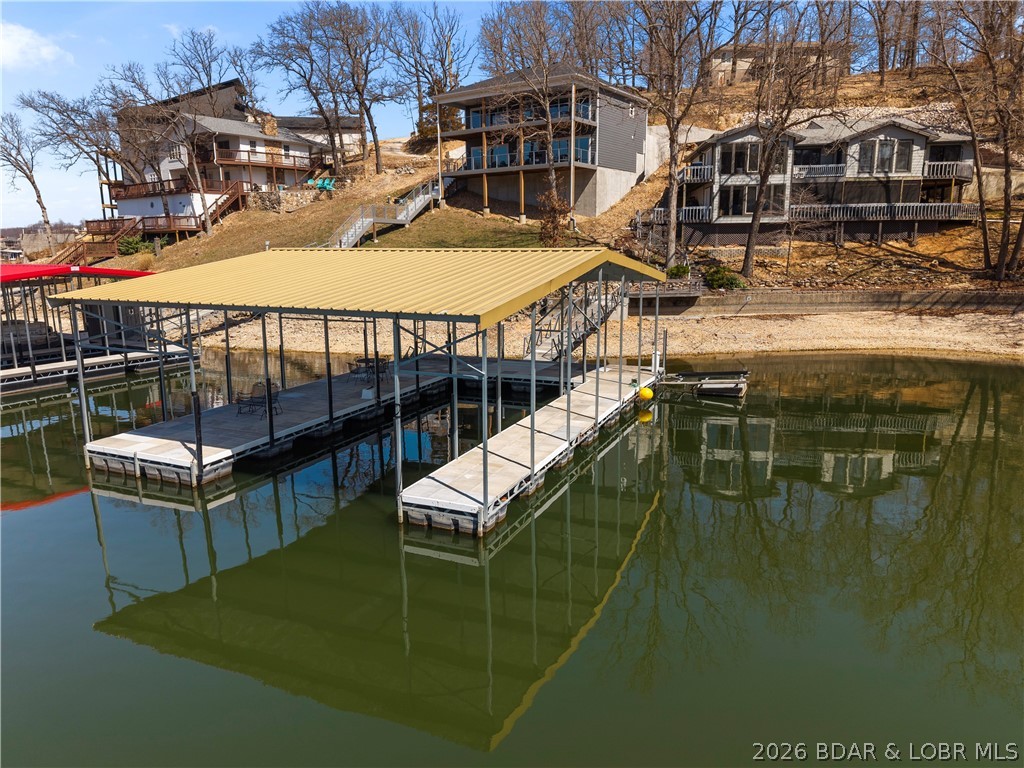 498 Wilmore Road Lake Ozark, MO 65049 - Photo 27 of 57 PWC Hoist connected to dock