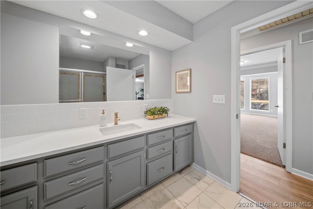 498 Wilmore Road Lake Ozark, MO 65049 - Photo 43 of 57 Main level guest bath has large vanity to accomoda