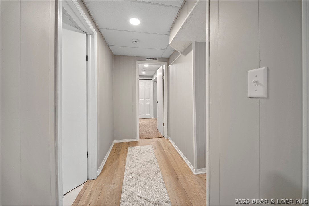 498 Wilmore Road Lake Ozark, MO 65049 - Photo 44 of 57 Hallway separating guests to their own rooms