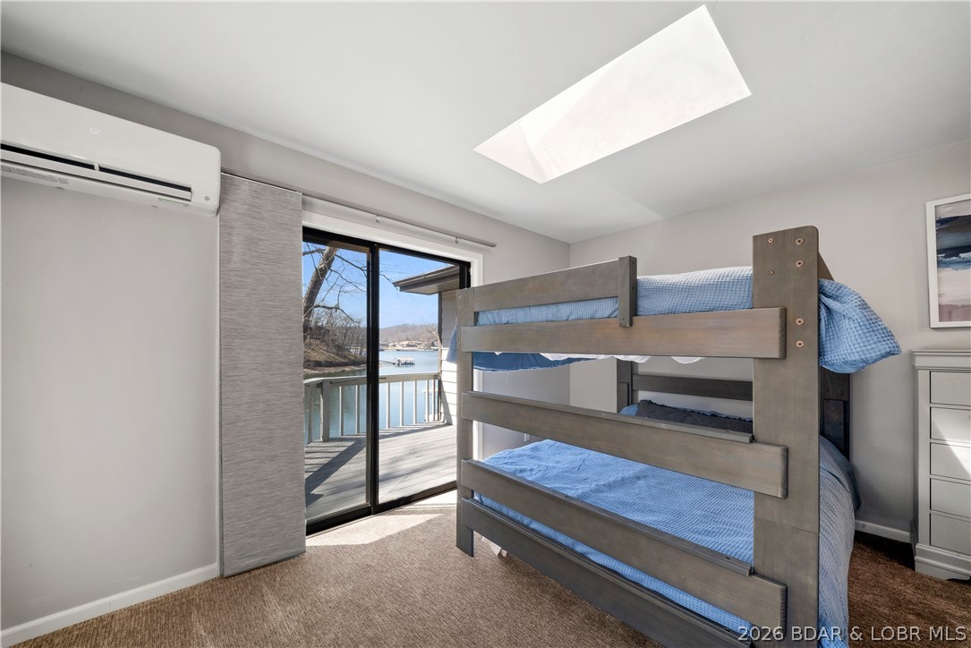 498 Wilmore Road Lake Ozark, MO 65049 - Photo 52 of 57 2nd Bunk Room on Main level with deck/lake view ac