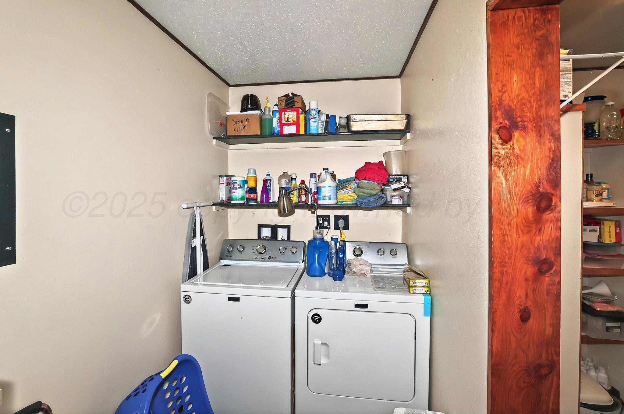 6005 Gainsborough Road Amarillo, TX 79106 - Photo 14 of 19 a utility room with dryer and washer