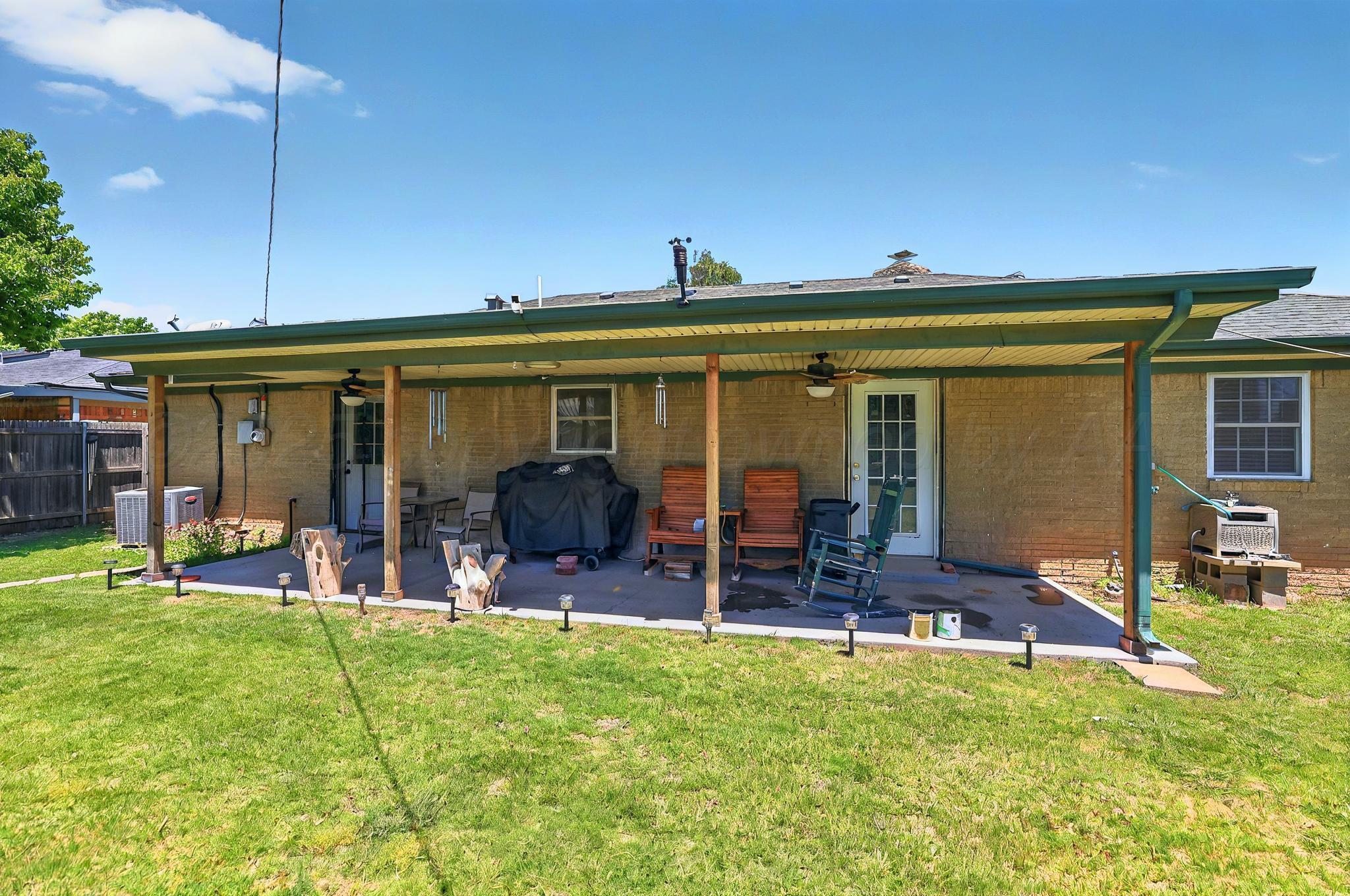 6005 Gainsborough Road Amarillo, TX 79106 - Photo 15 of 19 a view of an house with backyard porch and furniture