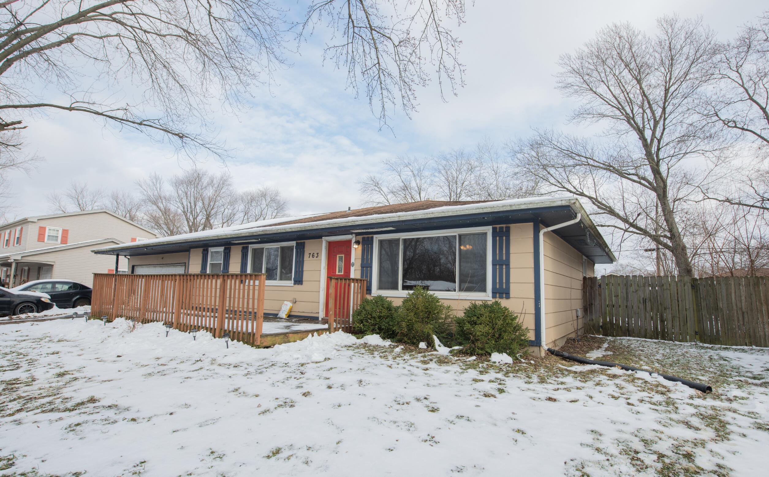 763 Timberline Parkway Valparaiso, IN 46385 - Photo 1 of 16 a view of a house with a yard covered in snow