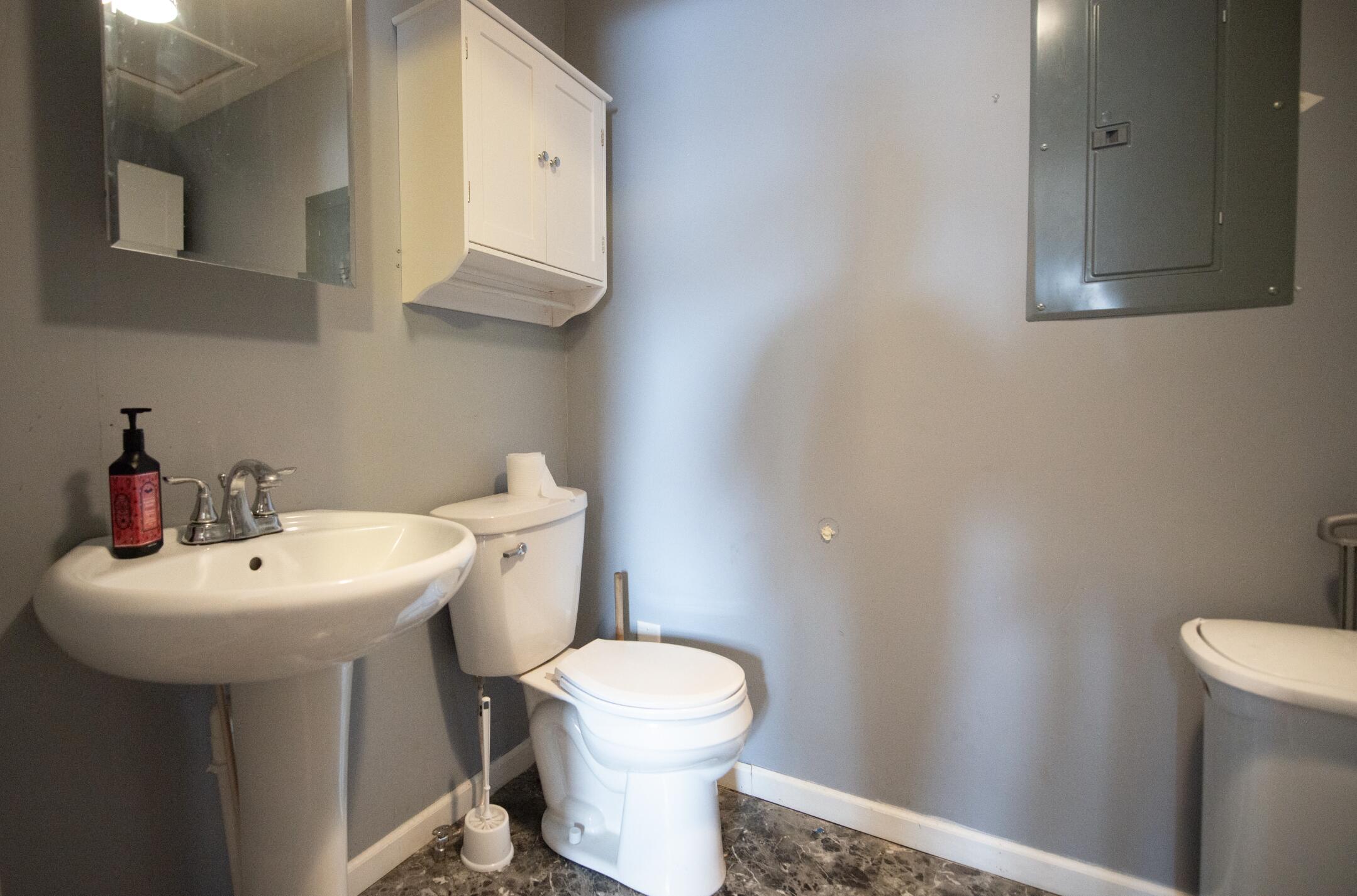 763 Timberline Parkway Valparaiso, IN 46385 - Photo 11 of 16 a bathroom with a sink a toilet and mirror