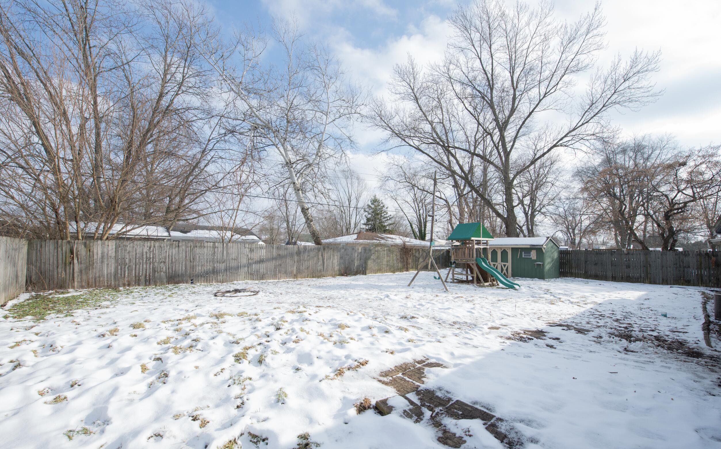 763 Timberline Parkway Valparaiso, IN 46385 - Photo 14 of 16 a view of a yard covered in snow