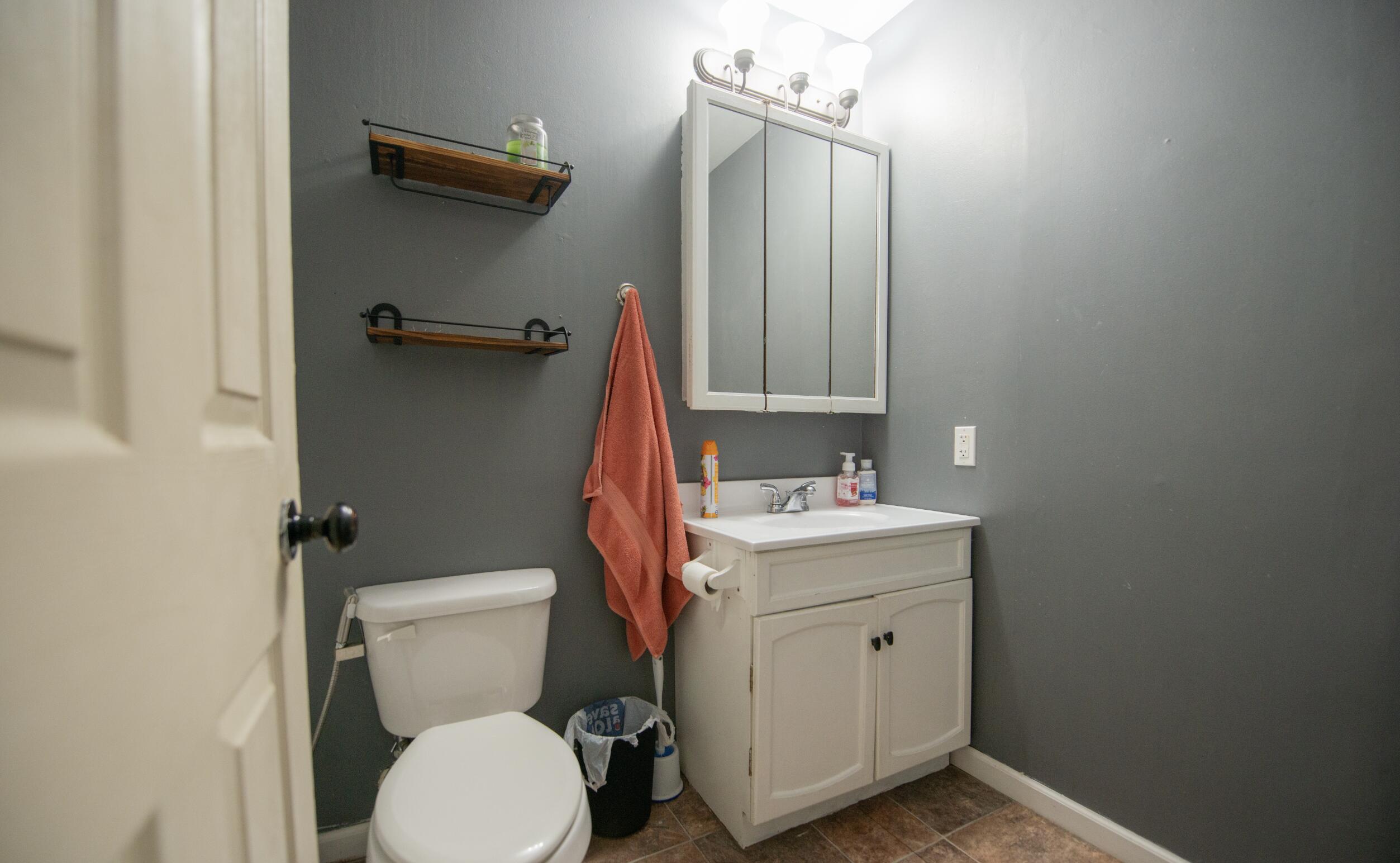 763 Timberline Parkway Valparaiso, IN 46385 - Photo 8 of 16 a bathroom with a toilet sink and mirror