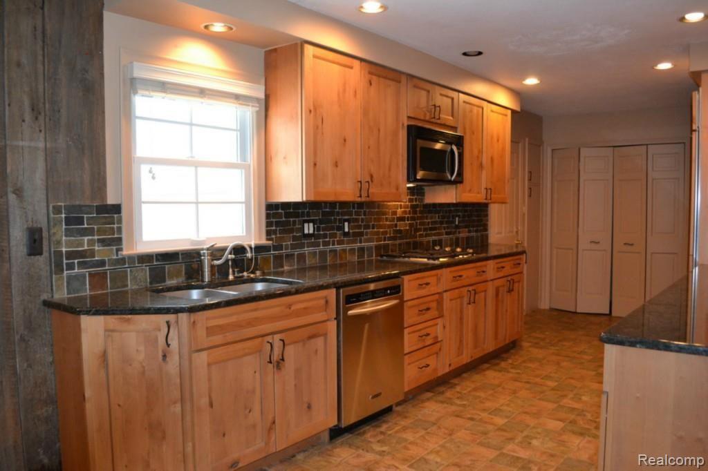 580 Covington Road Bloomfield Hills, MI 48301 - Photo 5 of 15 Newer Kitchen With Wolf & Sub Zero Appliances