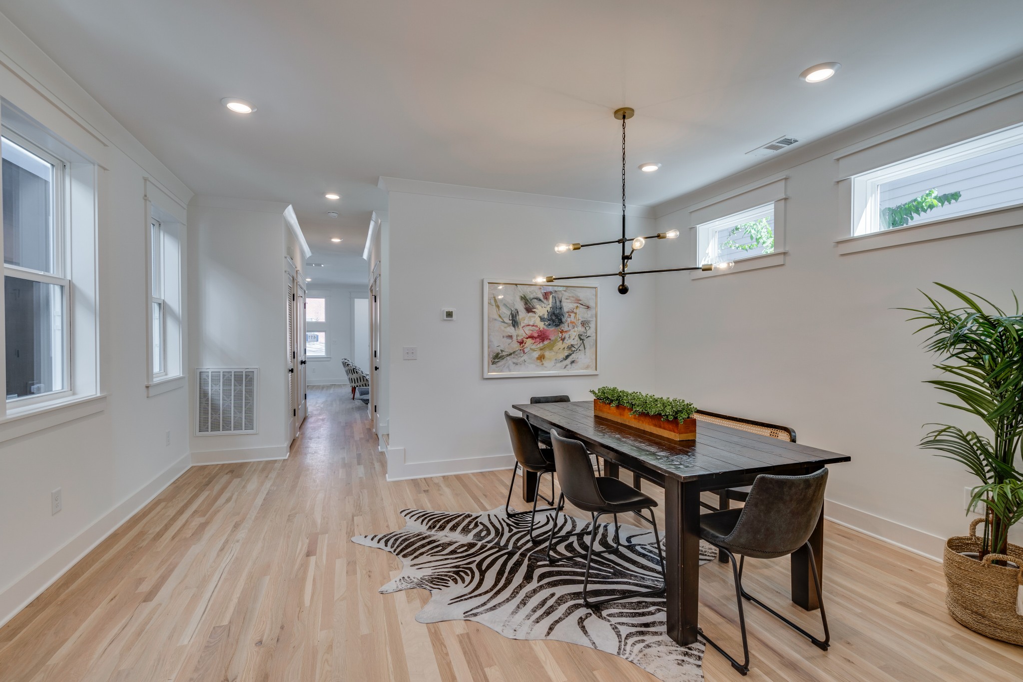 411 High Street Nashville, TN 37211 - Photo 11 of 32 a view of a dining room with furniture wooden floor and chandelier