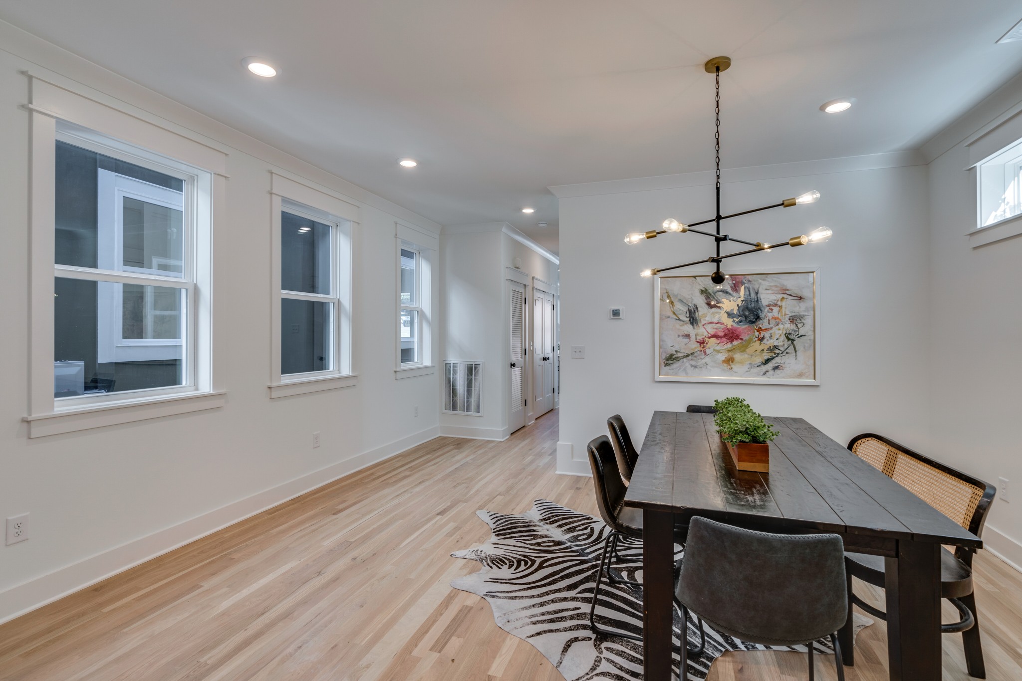 411 High Street Nashville, TN 37211 - Photo 12 of 32 a view of a dining room with furniture a chandelier and wooden floor
