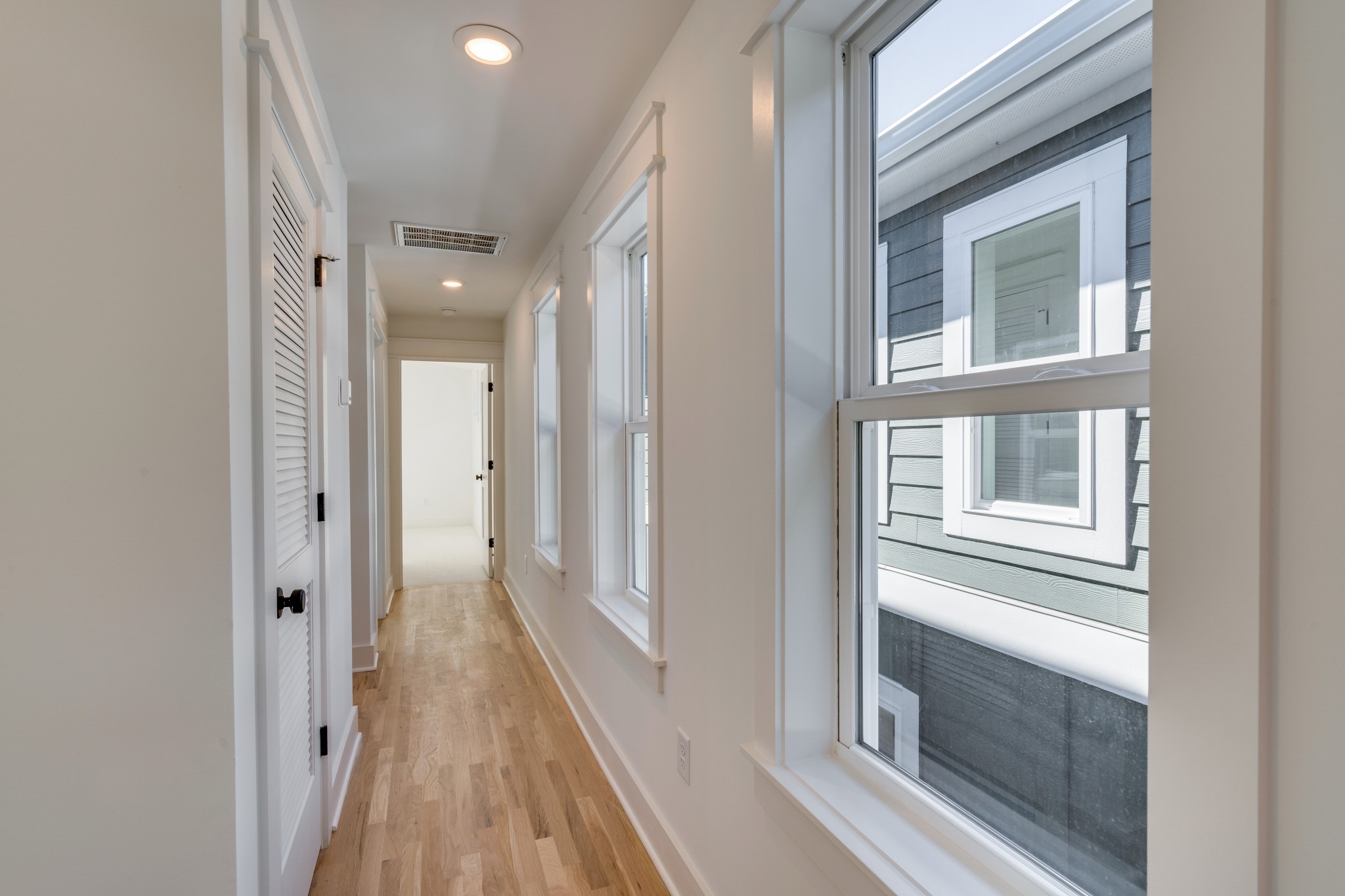 411 High Street Nashville, TN 37211 - Photo 18 of 32 a view of a hallway with a fireplace and windows