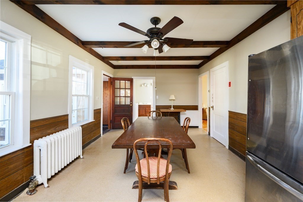 159 High Street Hingham, MA 02043 - Photo 11 of 27 a living room with furniture ceiling fan and a window