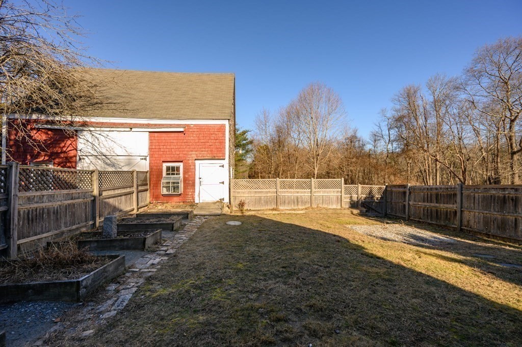 159 High Street Hingham, MA 02043 - Photo 23 of 27 a view of a backyard with large trees
