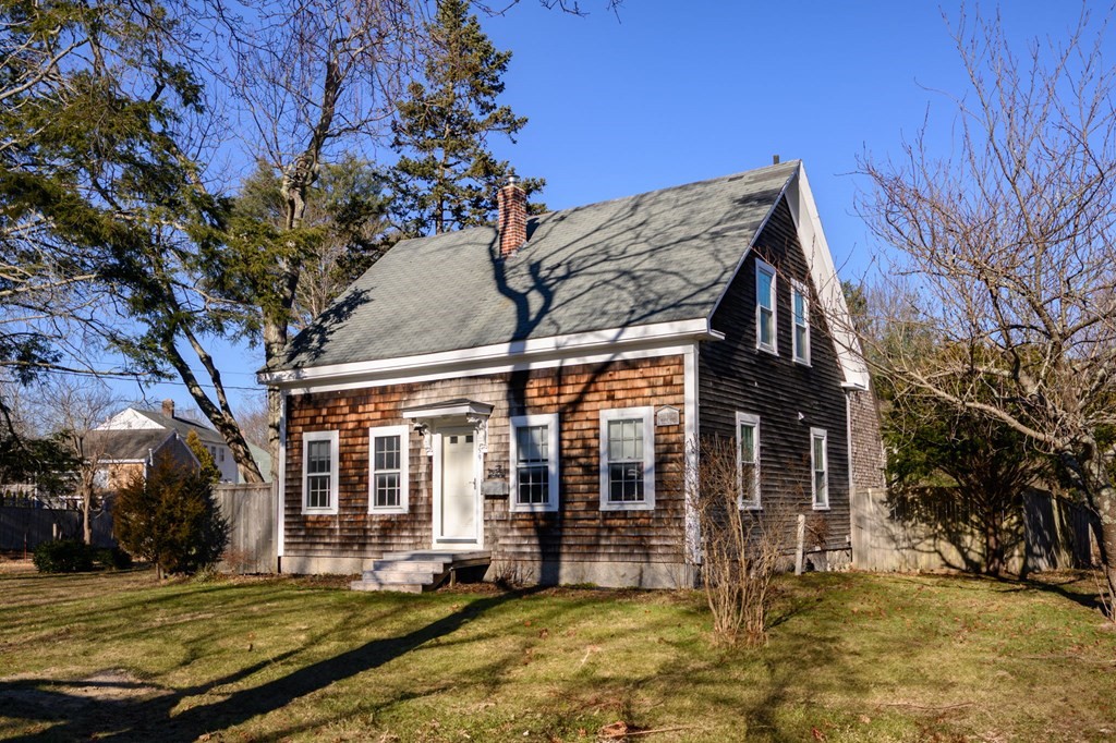 159 High Street Hingham, MA 02043 - Photo 27 of 27 a view of a house with a large window and a yard