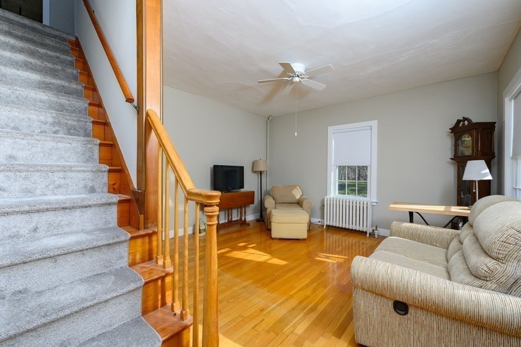159 High Street Hingham, MA 02043 - Photo 7 of 27 a living room with furniture and a chandelier