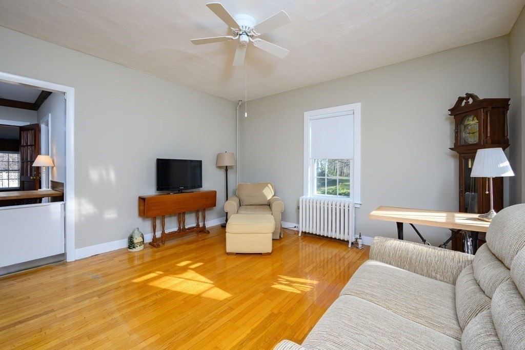 159 High Street Hingham, MA 02043 - Photo 8 of 27 a bedroom with a bed and wooden floor