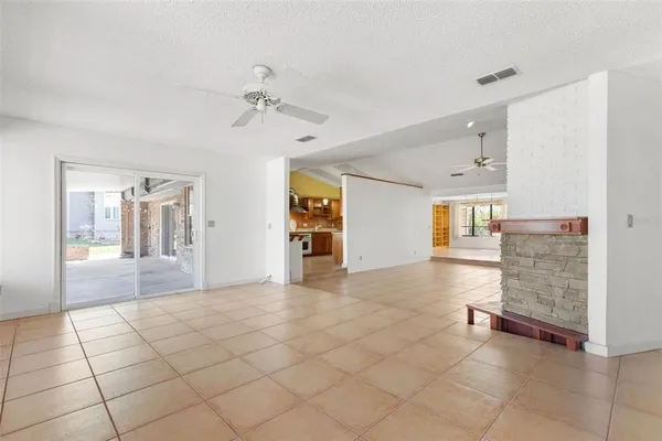 a large kitchen with stainless steel appliances lots of counter space and a sink