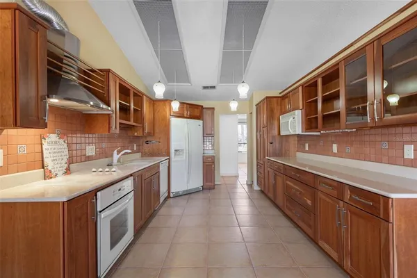 a kitchen with stainless steel appliances a refrigerator and a sink