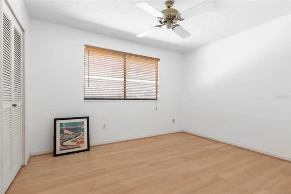 a backyard of a house with barbeque oven table and chairs
