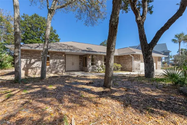 front view of a house with a large window