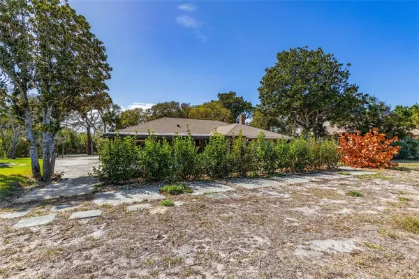 an aerial view of a house with a garden