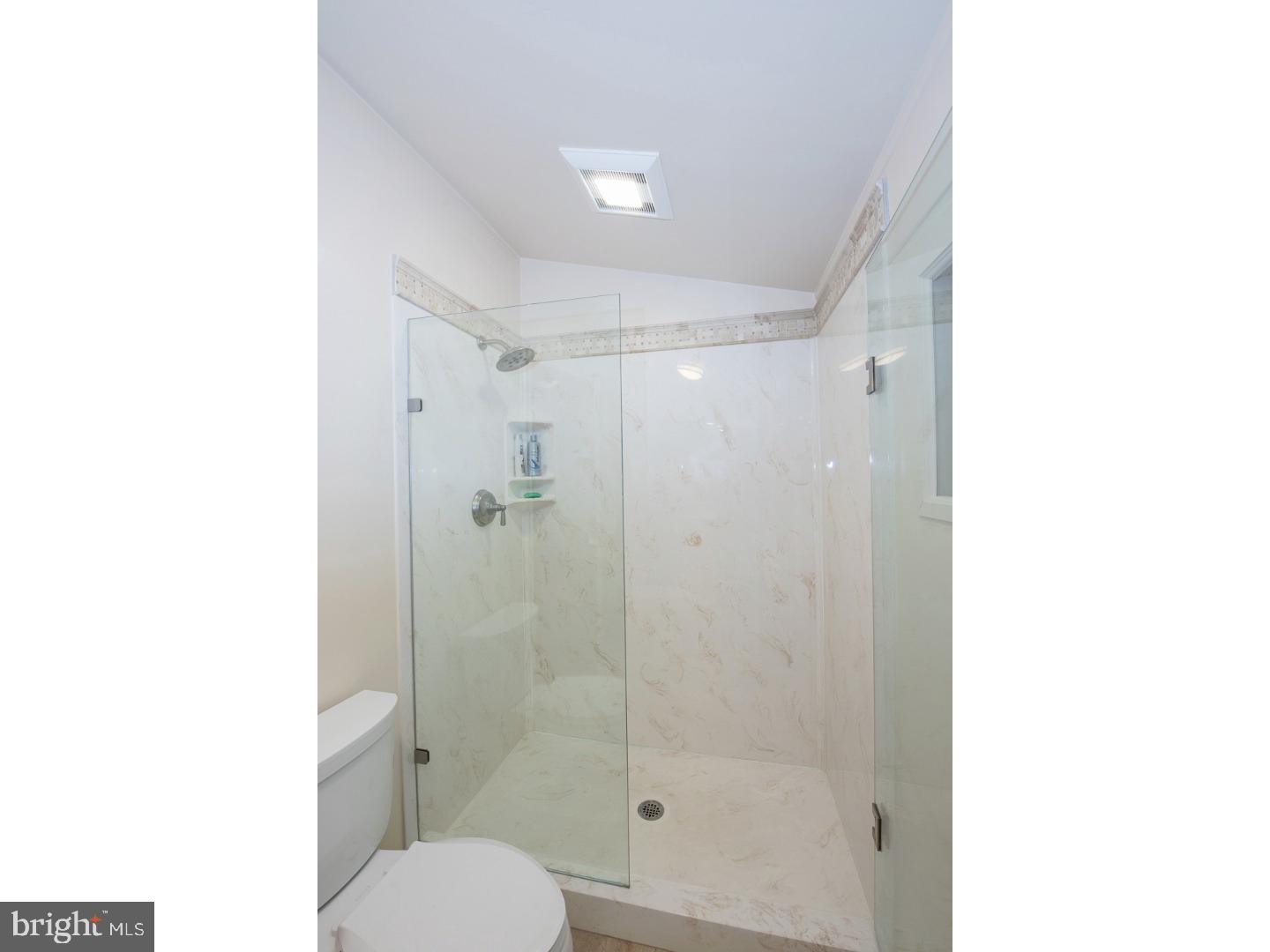 597 Upper Weadley Road Wayne, PA 19087 - Photo 11 of 25 a bathroom with a shower and a toilet