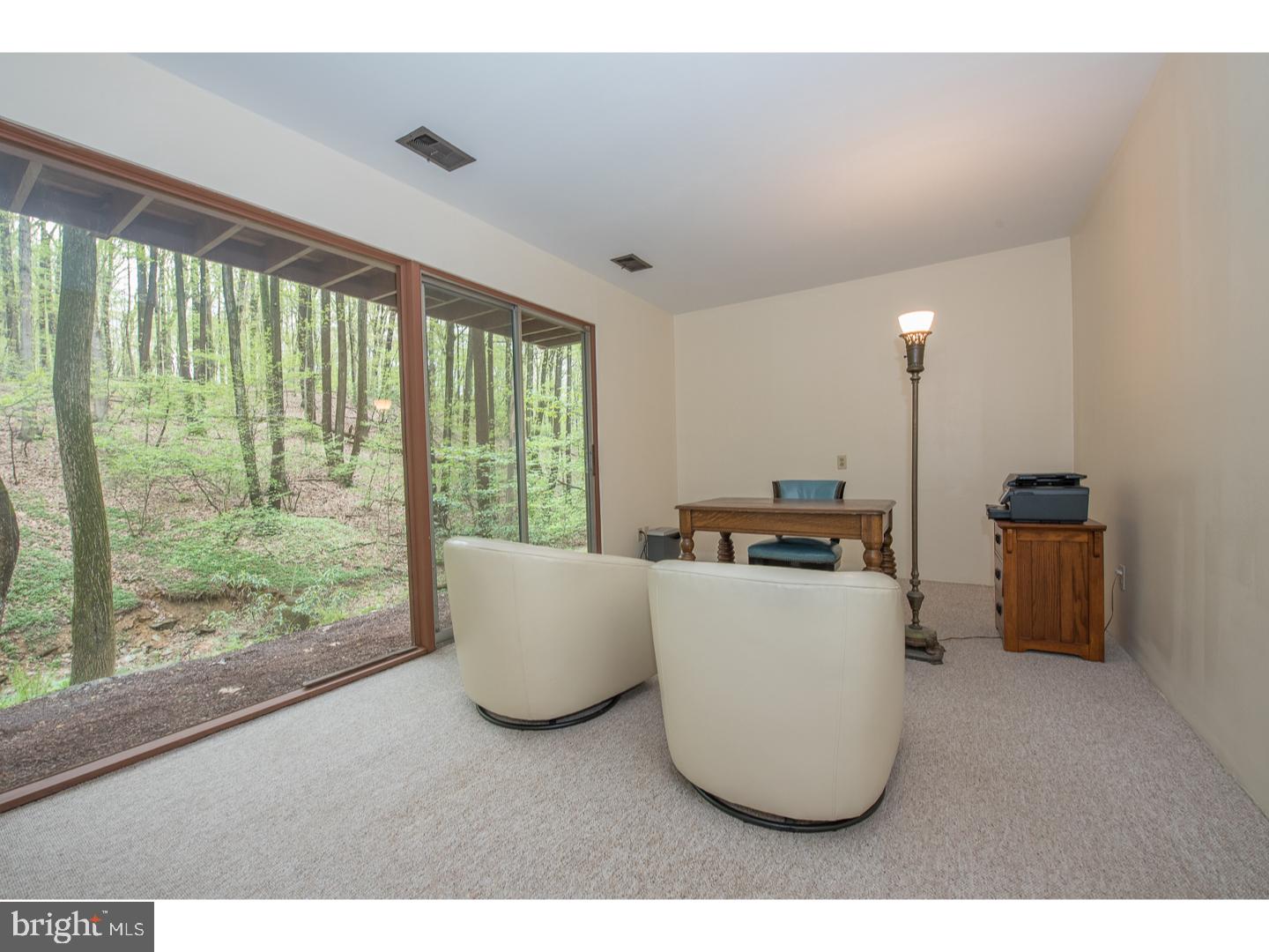 597 Upper Weadley Road Wayne, PA 19087 - Photo 12 of 25 a living room with furniture and a large window