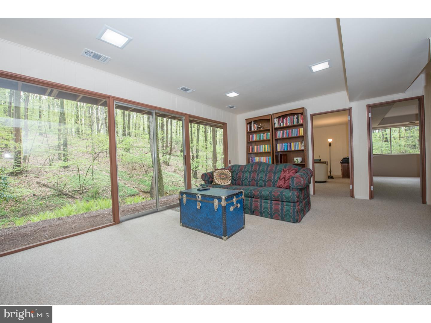 597 Upper Weadley Road Wayne, PA 19087 - Photo 14 of 25 a living room with furniture and a large window