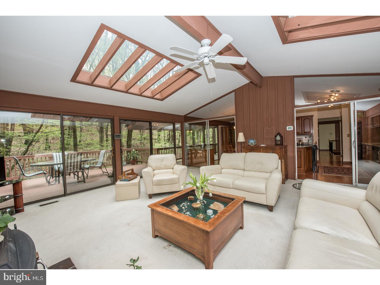 597 Upper Weadley Road Wayne, PA 19087 - Photo 8 of 25 a living room with furniture and a large window with view of living room