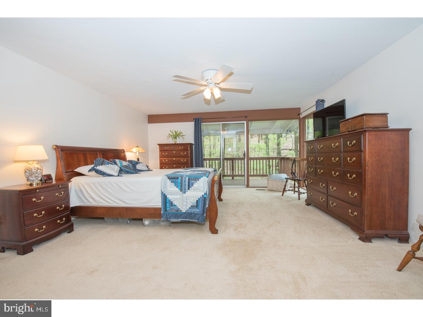 597 Upper Weadley Road Wayne, PA 19087 - Photo 10 of 25 a bed room with a bed and a large window