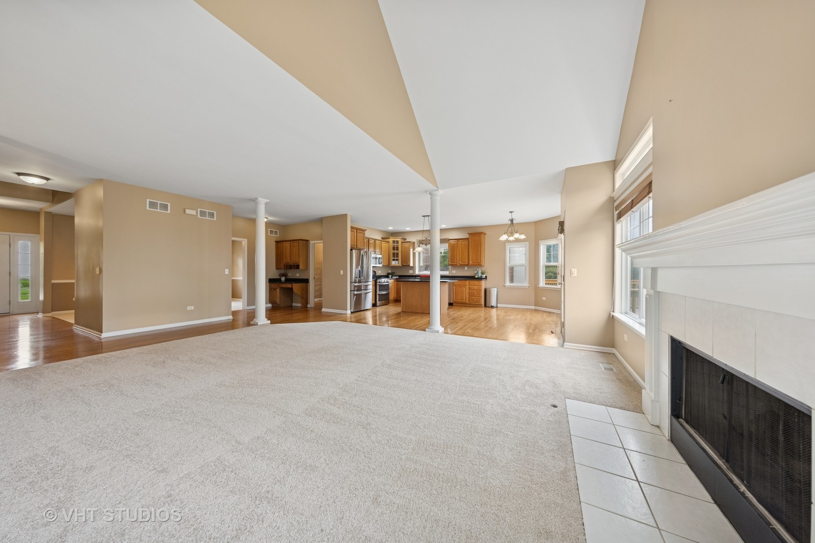 12804 Stellar Lane Plainfield, IL 60585 - Photo 12 of 37 a view of empty room with wooden floor and fireplace
